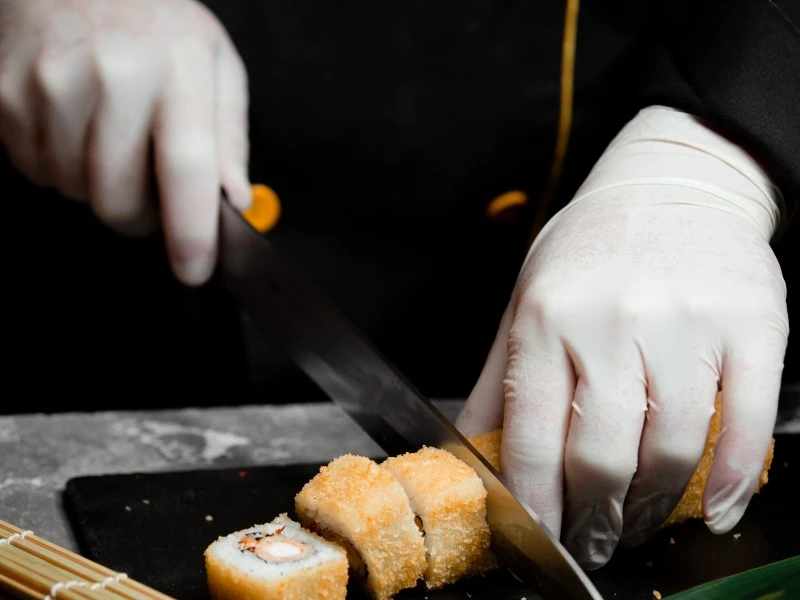 cutting sushi with a sushi knife